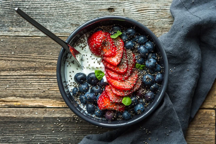 bowl of Greek yogurt with fruit and chia seeds