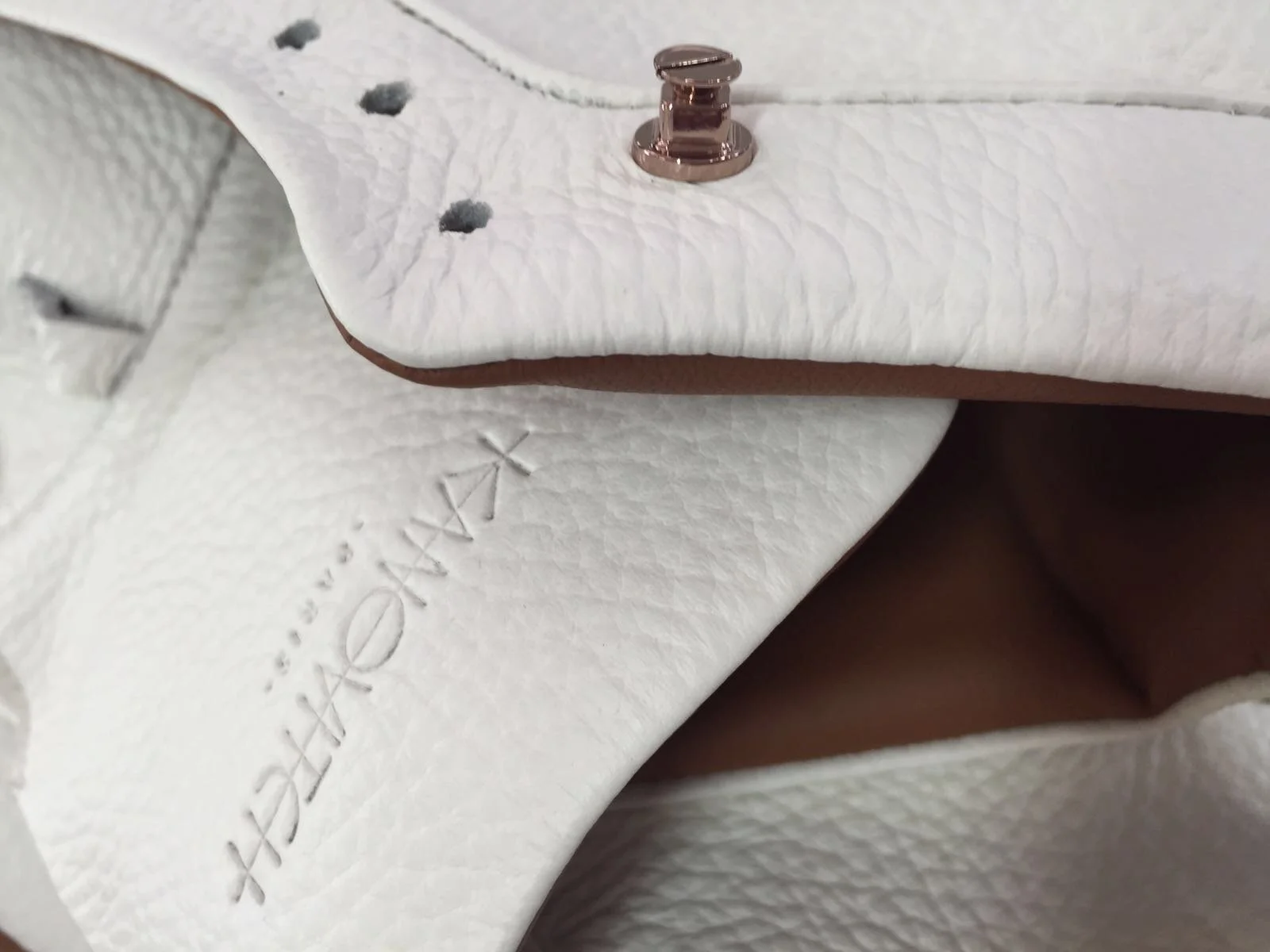 KANOVITCH sneaker detail—precious metal accessories, and the sweetness of leather.