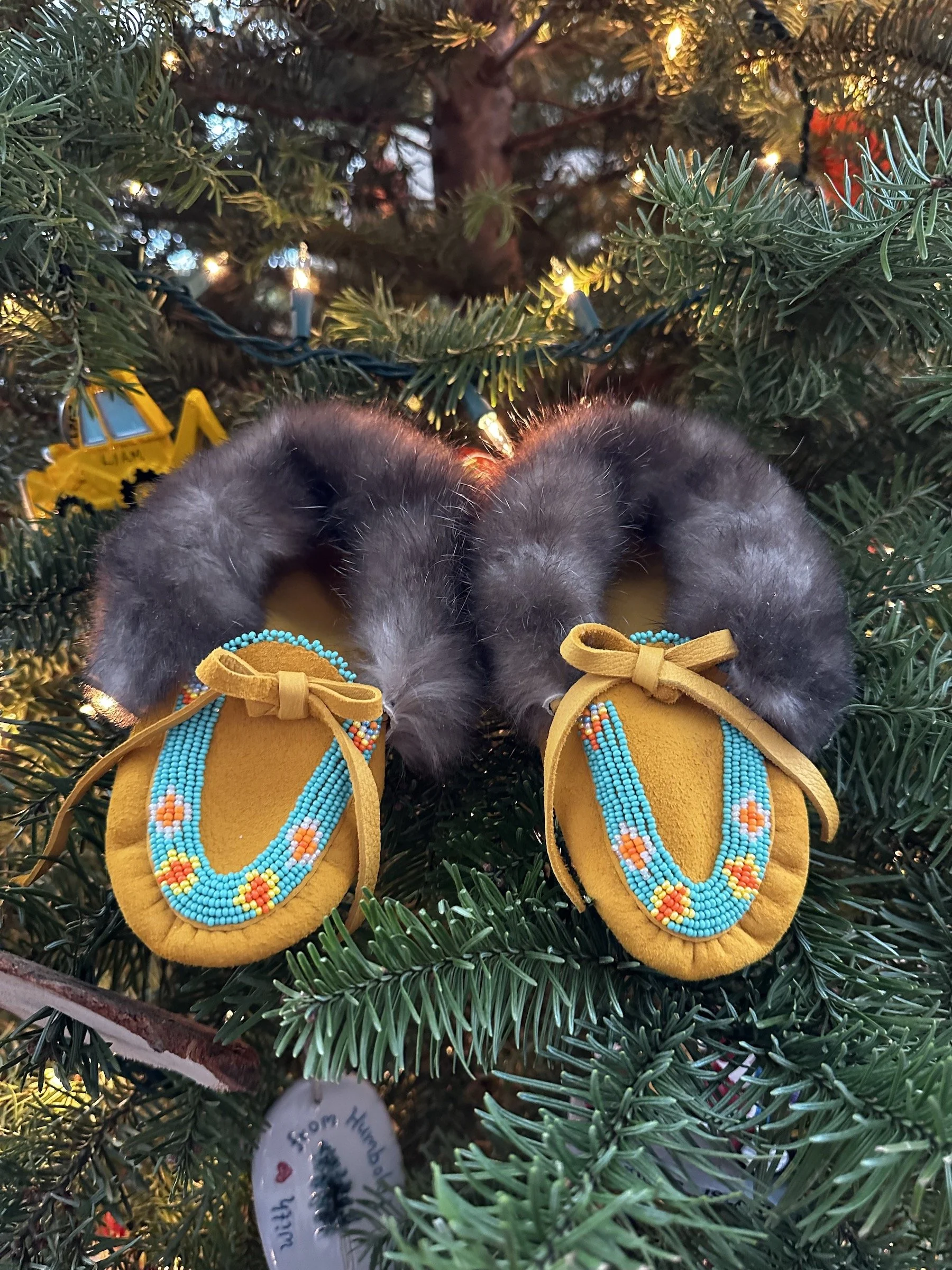 Kids sea otter fur lined beaded moccasins