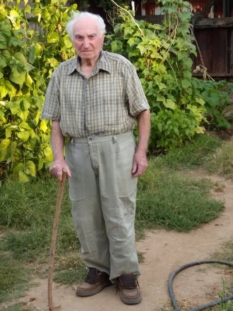 Dad in front of string beans.JPG