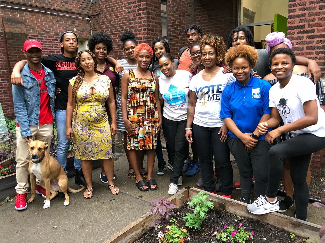Kina with community members.