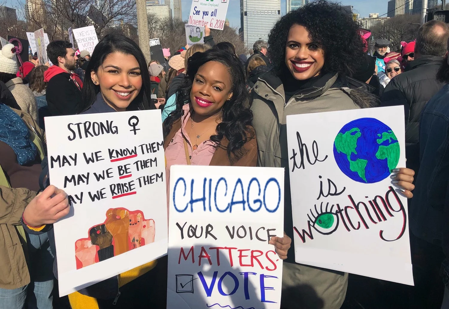 Kina at the Chicago Women’s March with a sign that reads “Chicago Your Voice Matters - Vote.”