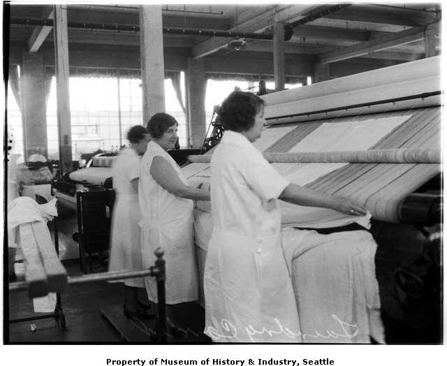 Women_working_at_pressing_machine_in_commercial_laundry_January_1935.jpg