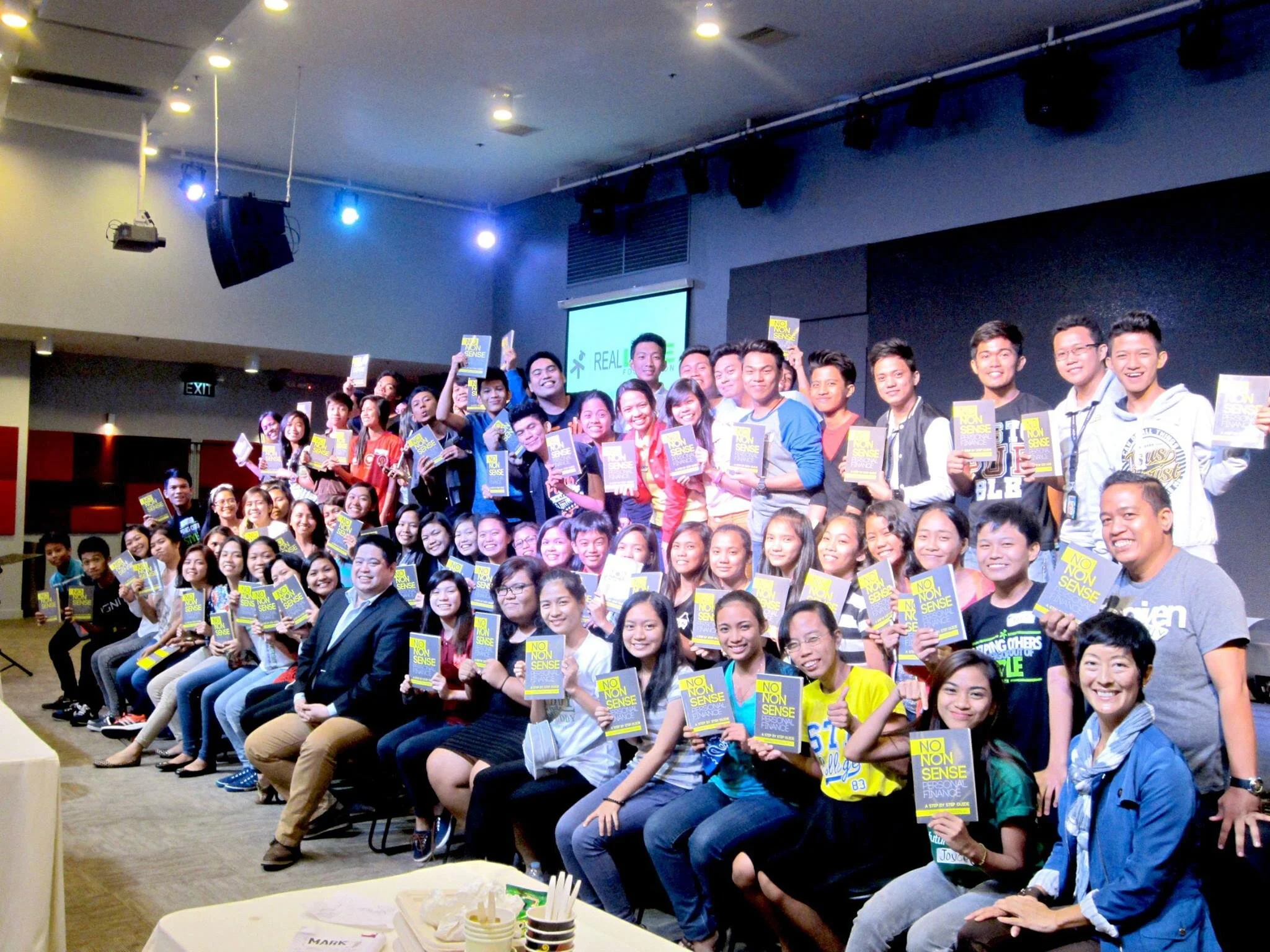 Randell Tiongson with Real LIFE scholars when he did a financial training for them in 2015. He also gave them copies of his book “No Non-Sense Personal Finance”.