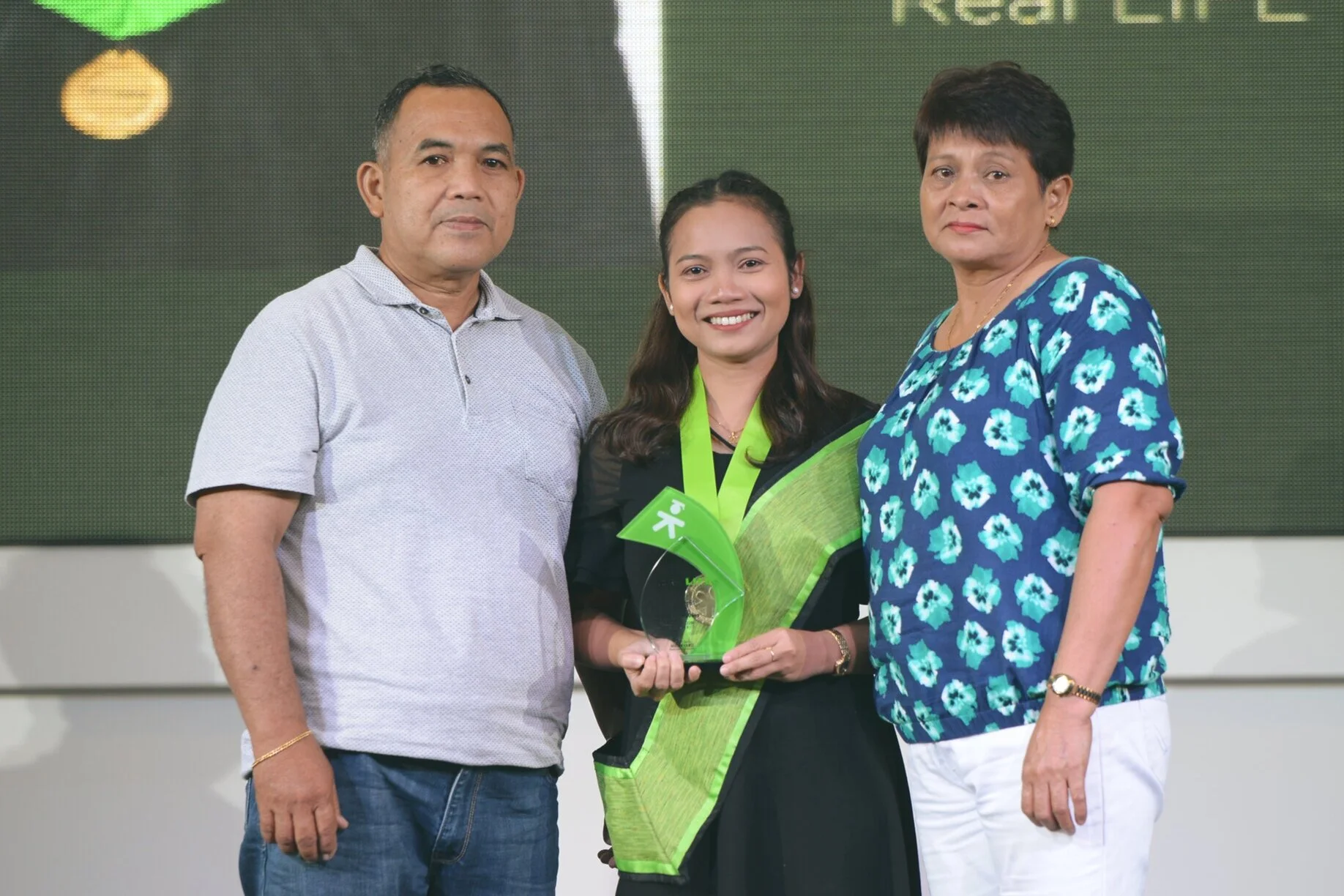 Jonalyn with her parents receiving the faith award at our South Luzon Graduation last August 17, 2019. Her father is now strong and well and is on his way to full recovery.