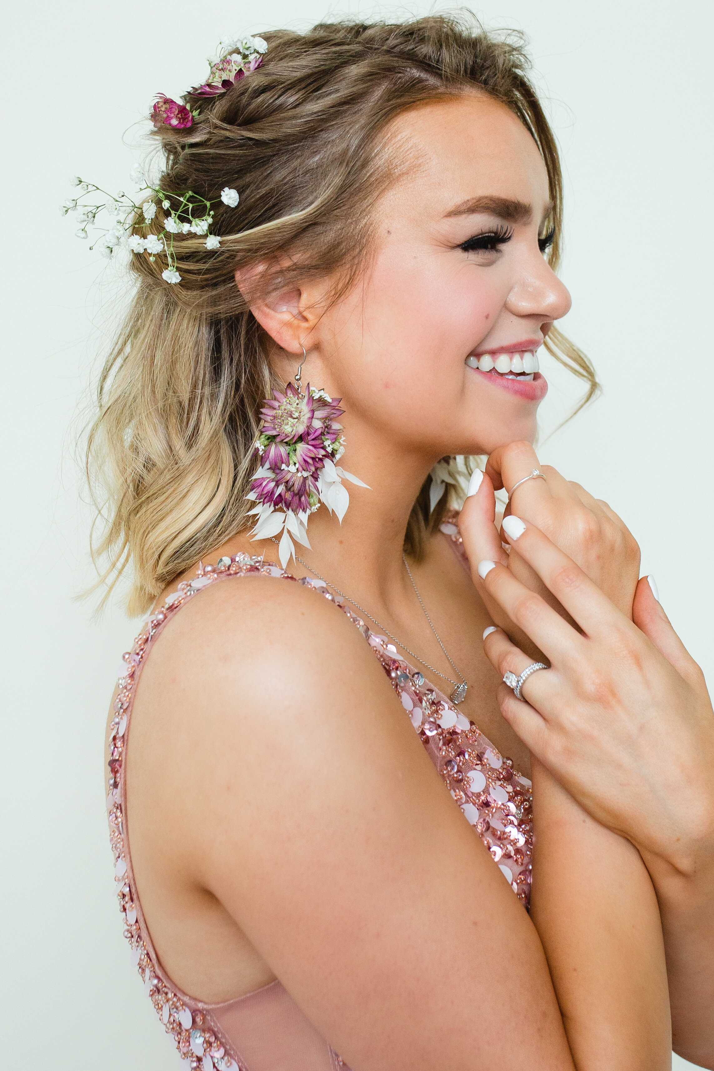  Logan, Utah’s Sweet Afton Floral created a custom dainty floal hair piece for a formal gala night. floral hair piece to match dress, formal champagne sequin gala dress, rose gold large sangle statement womens earrings, professional event floral desi