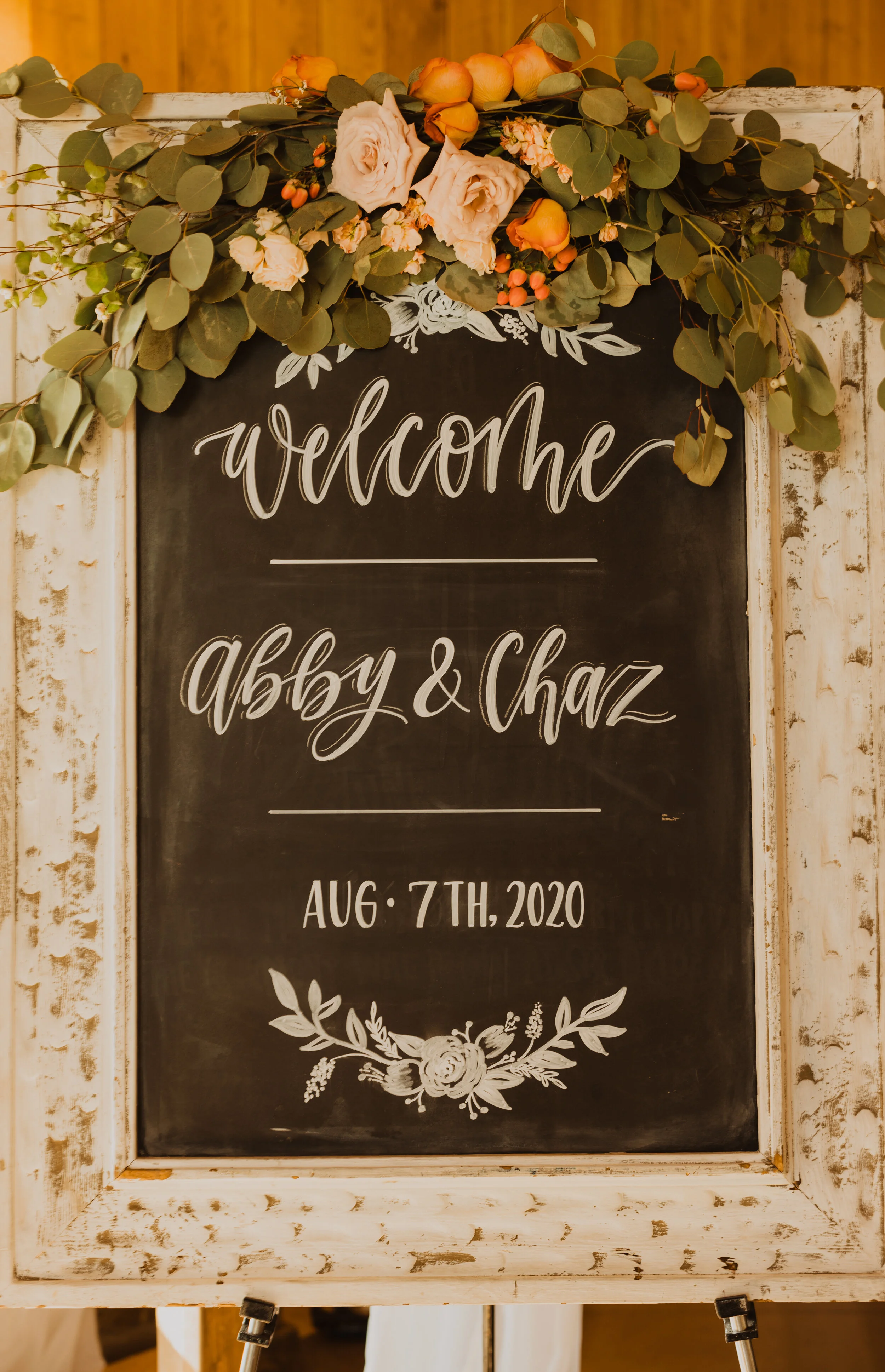 At this rustic wedding reception venue in Logan, Utah, Sweet Afton Floral created a small floral installation for this chalk board wedding welcome sign. wedding welcome sign, wedding chalk board, wedding decor, wedding flowers, logan utah wedding fl