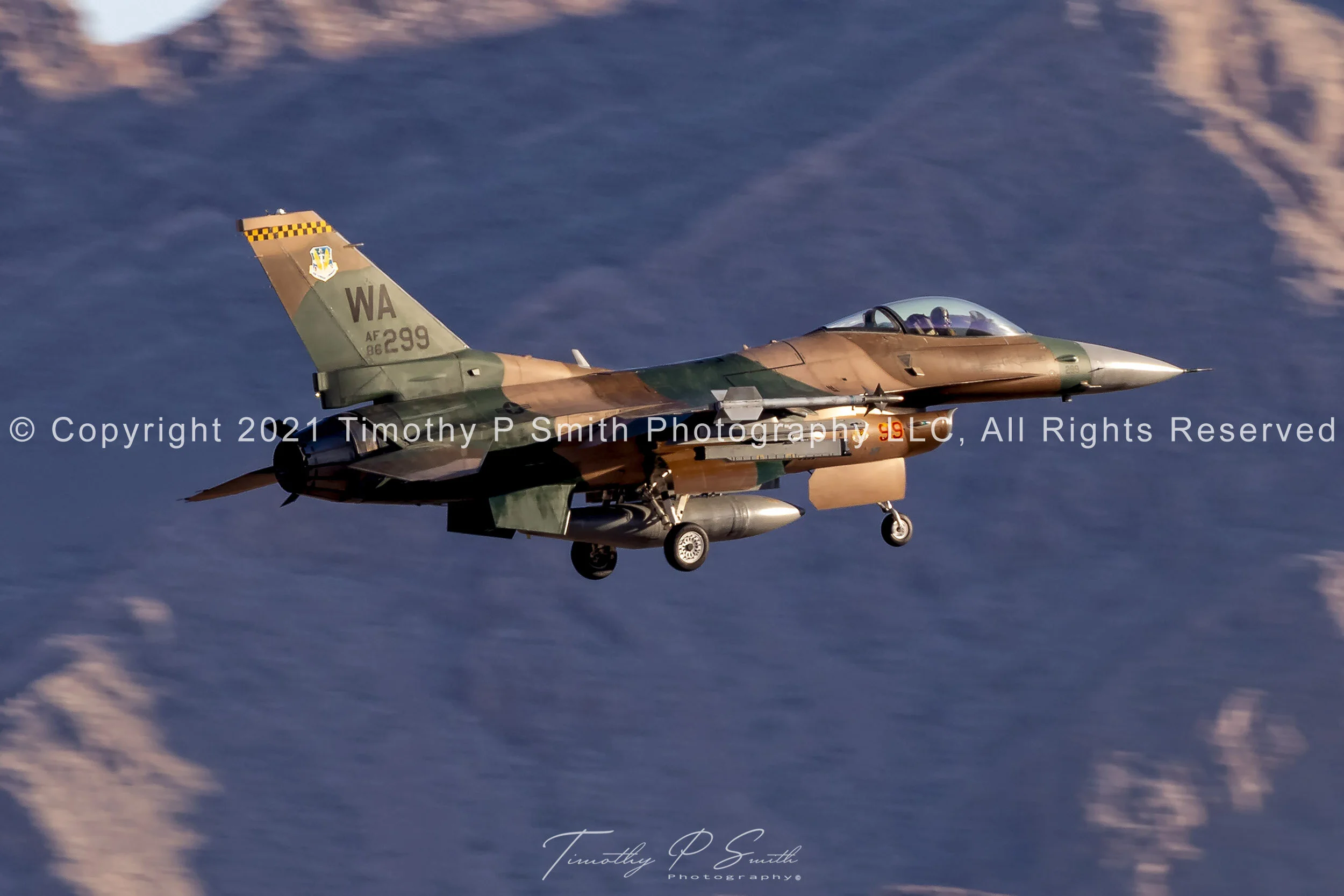 F-16C “Lizard” of the 64th Aggressor Squadron on final approach to Nellis AFB with Sunrise Mountain in the background, February 12, 2020