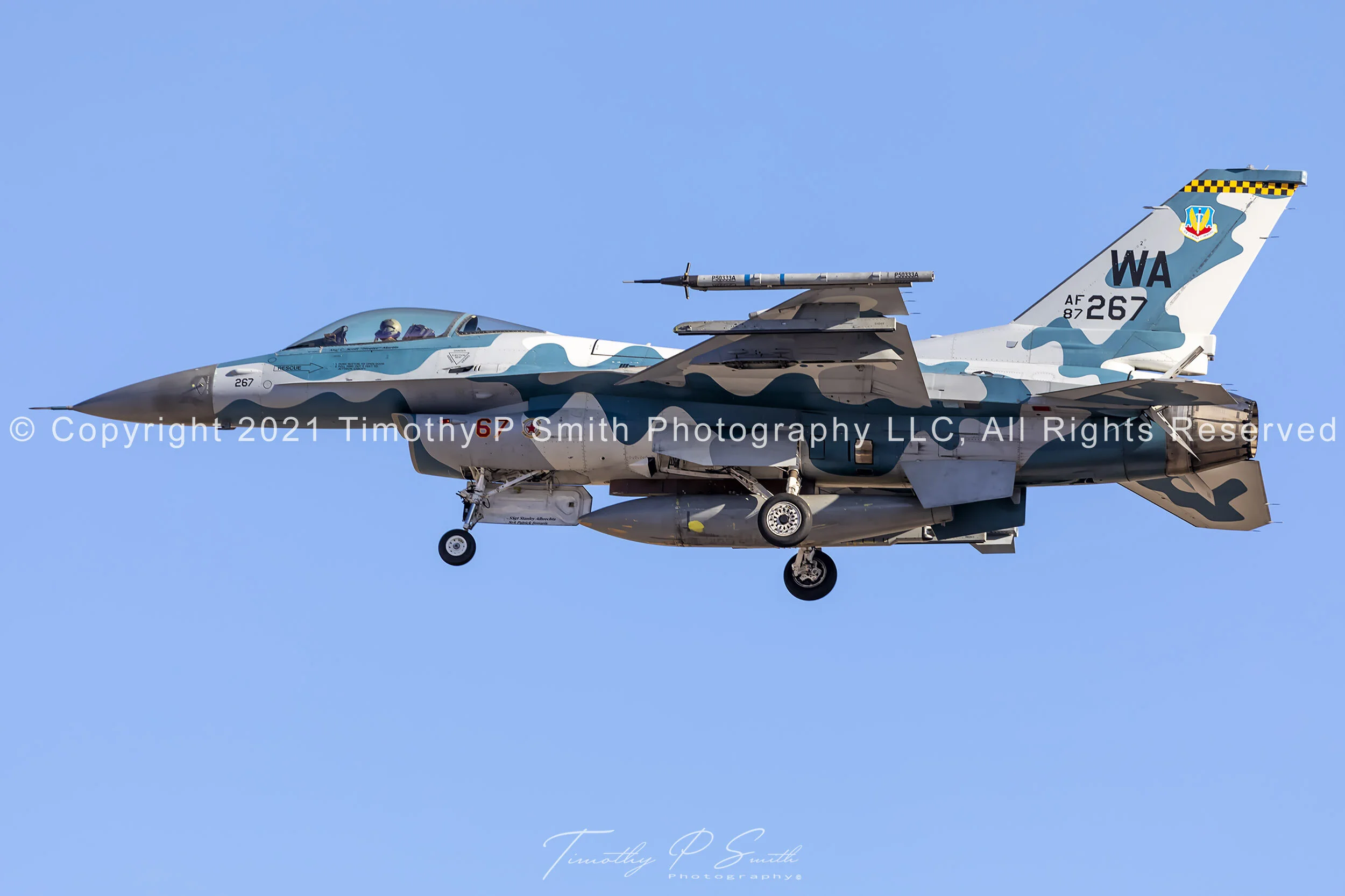 F-16C “Blizzard” of the 64th Aggressor Squadron on final approach to Nellis AFB with landing gear down, painted in Su-30MKI-inspired camouflage