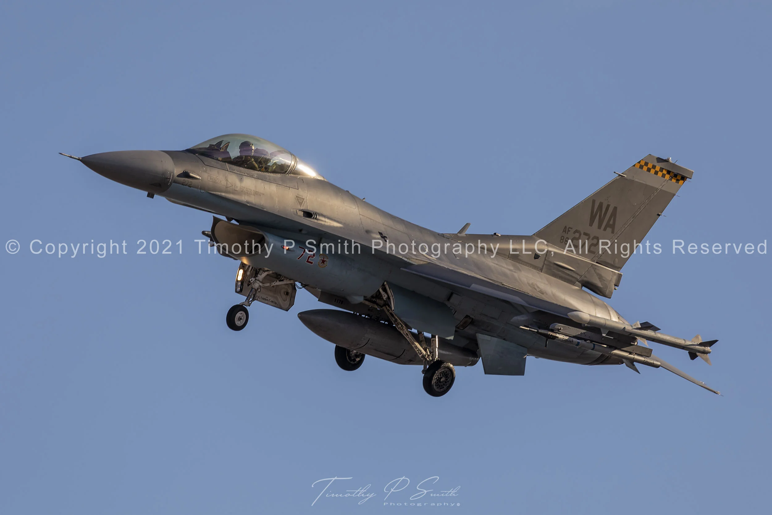 F-16C “Shark” of the 64th Aggressor Squadron in golden hour light at Nellis AFB, wearing Su-57-inspired camouflage