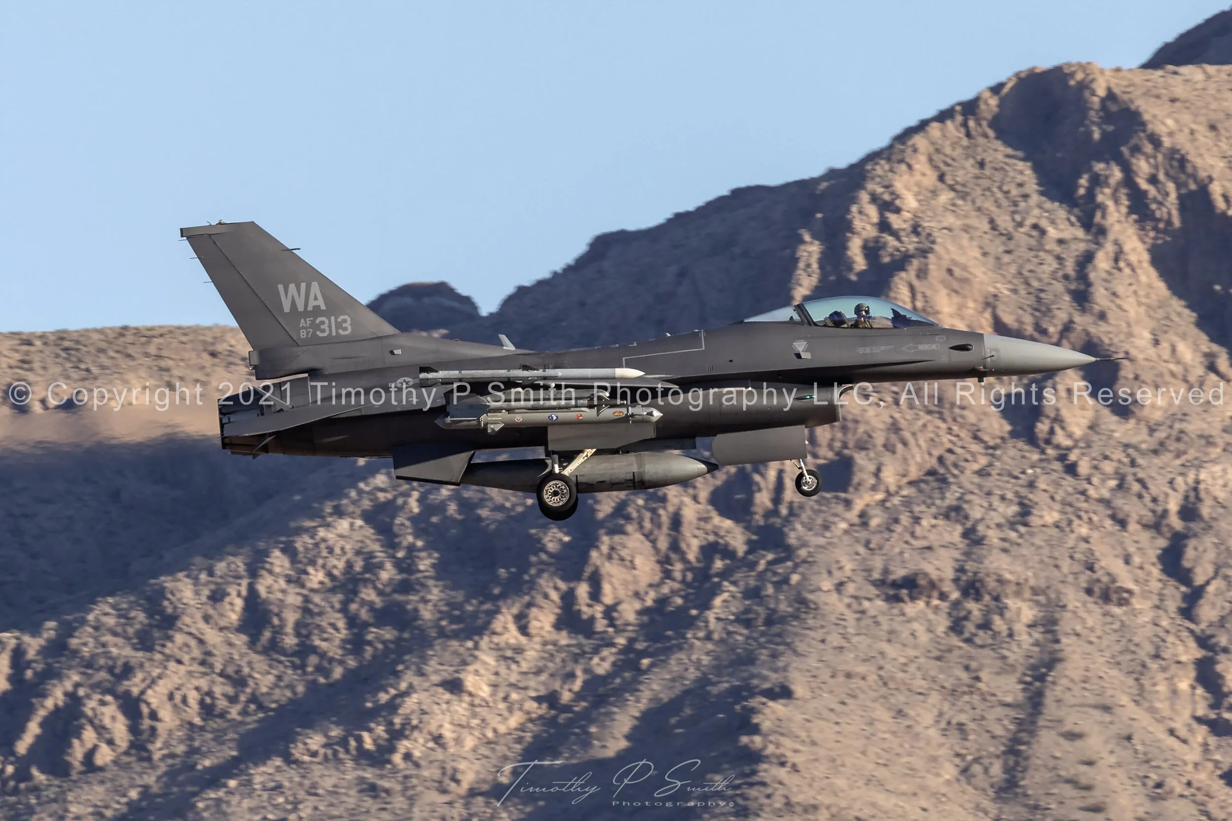 F-16C “Have Glass” of the 64th Aggressor Squadron on landing approach at Nellis AFB, RAM-coated paint