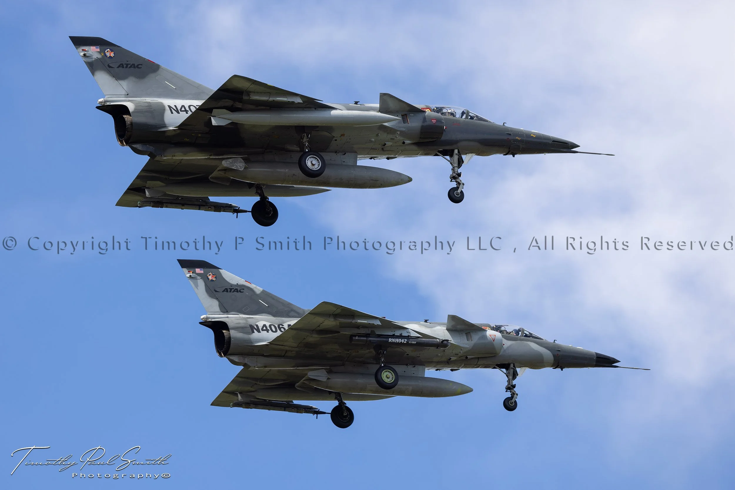 Two rare ATAC IAI F-21A Kfir aggressor jets (N407AX and N406AX) flying in formation over NAS JRB New Orleans in Belle Chasse, Louisiana.