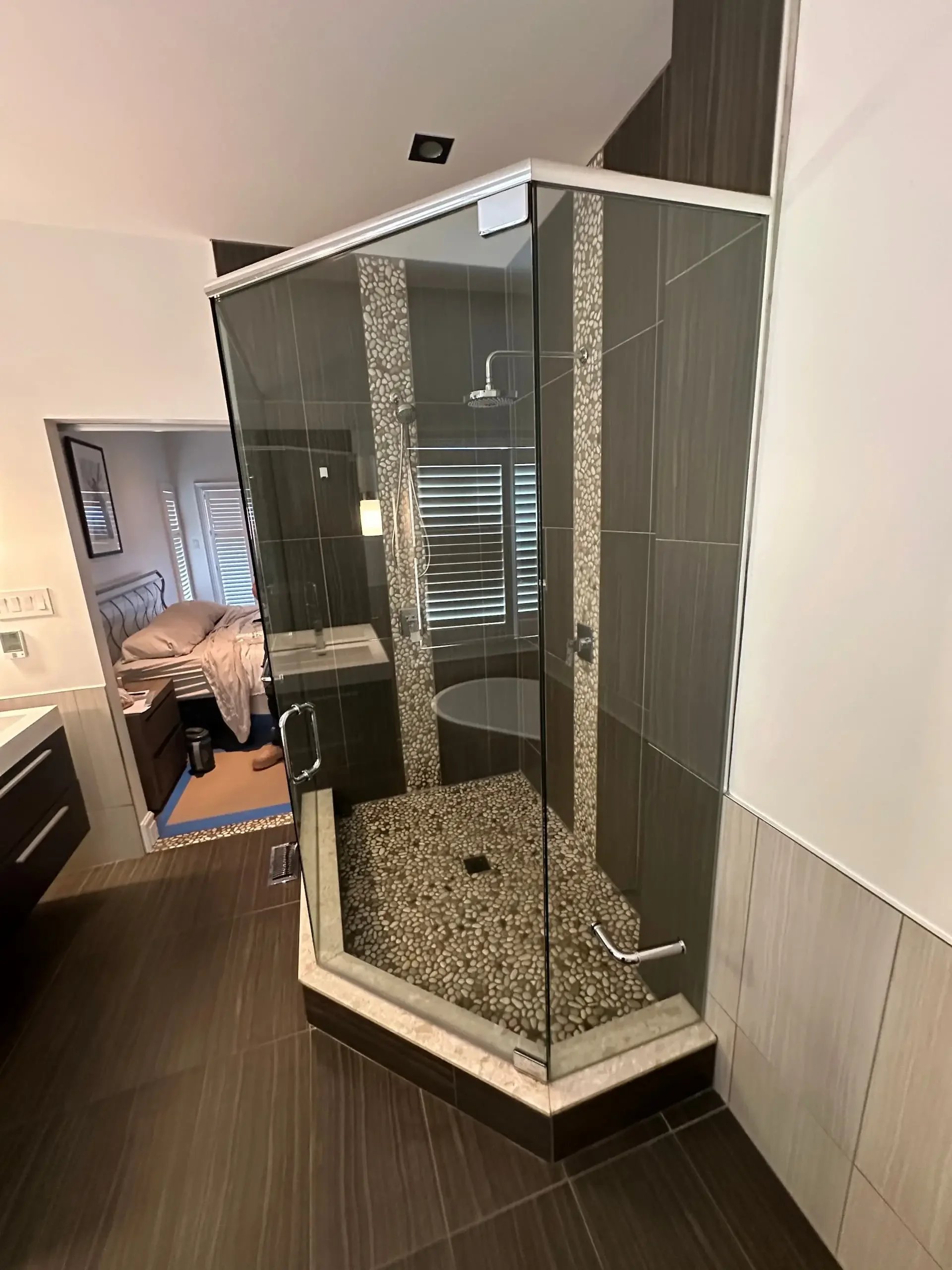 before Walk-in glass shower with tiled walls in a Kitchener bathroom