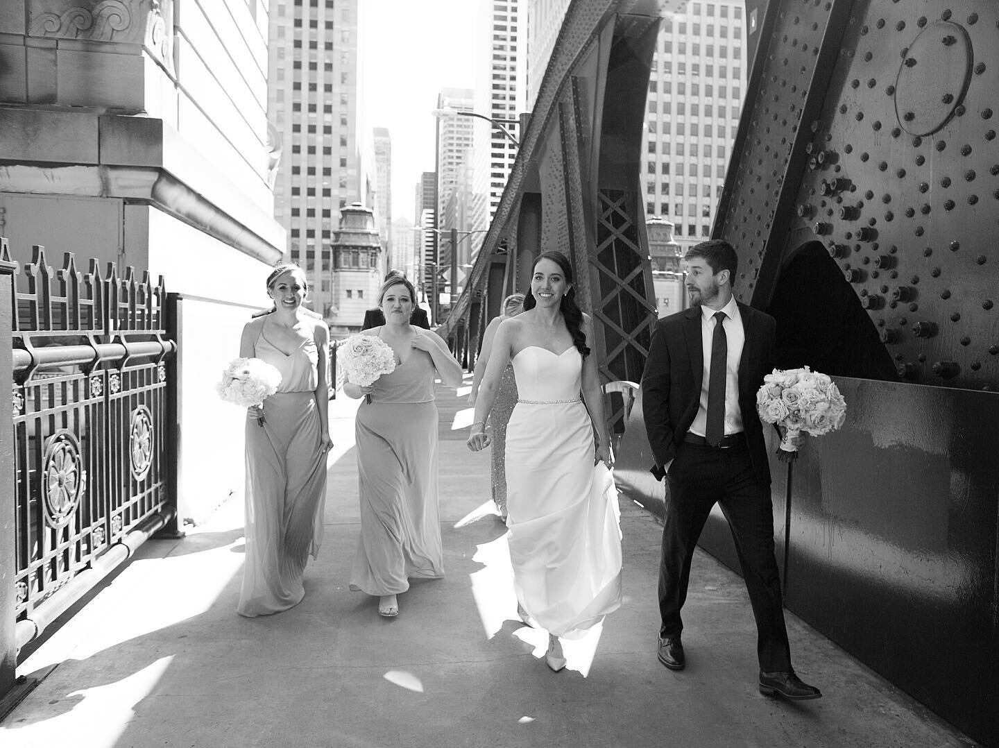 Love seeing this groom help hold his brides boutique while she holds her train - looking cool, calm and collected in downtown Chicago.