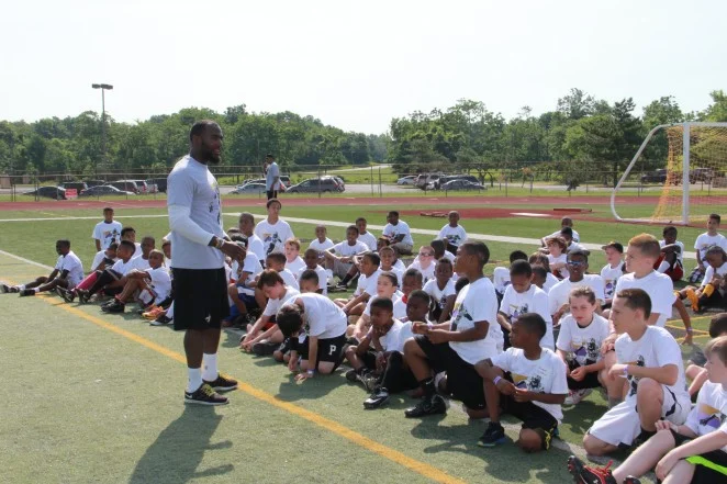 Local pro football players give back at camp for kids in Piscataway
