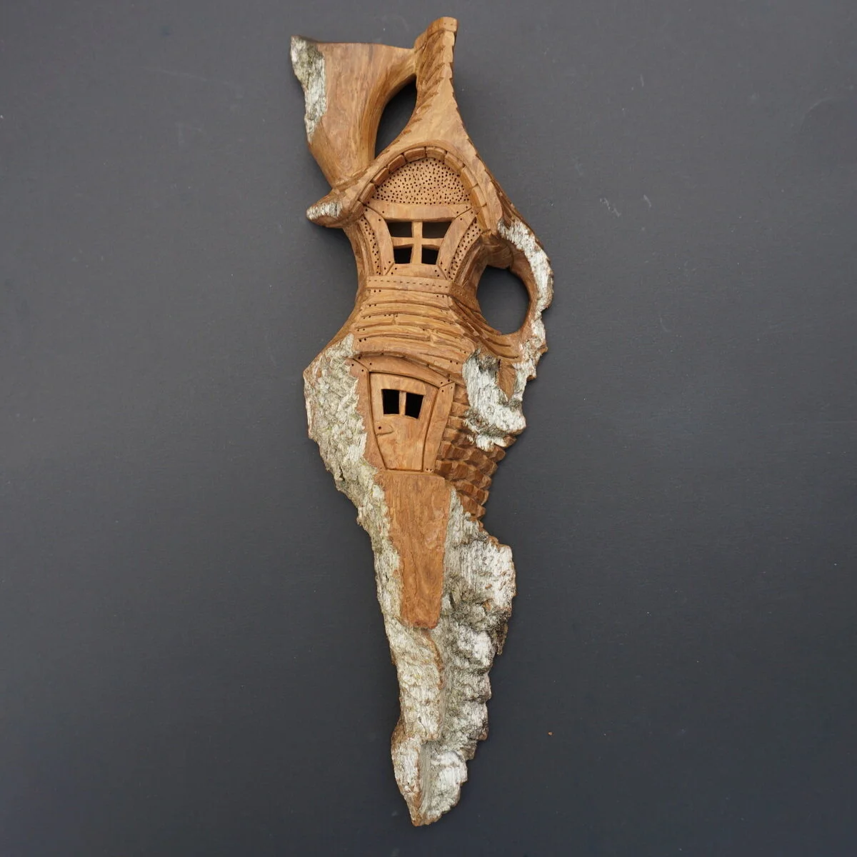 In the Clouds, cottonwood bark carving