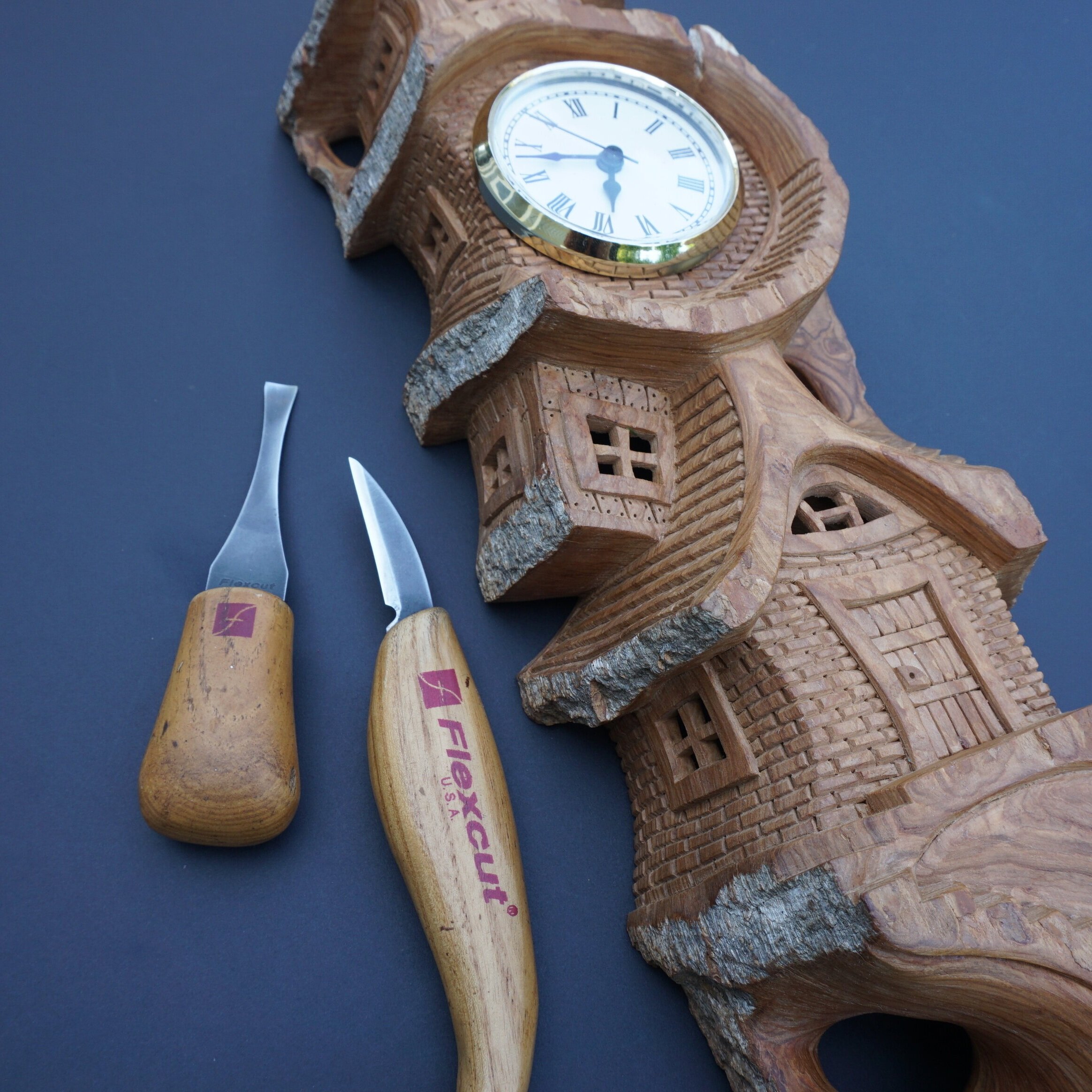 02+Whimsical+house+carving+wooden+clock.jpg