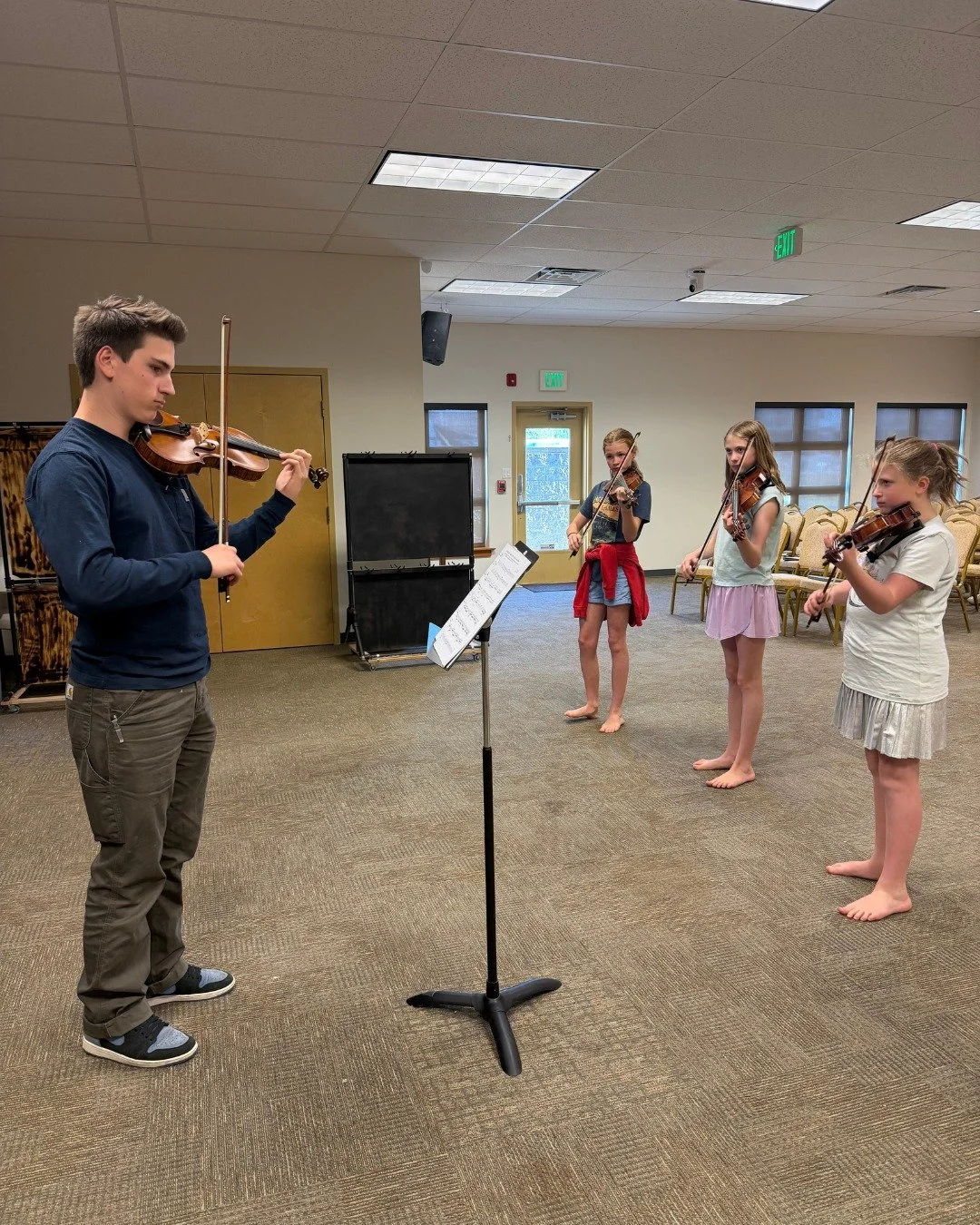 One of my favorite parts of Suzuki group class is watching students grow in confidence and leadership right alongside their musical skills.

Older students have the opportunity to encourage younger players, lead by example, and learn how to work toge