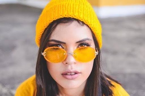 a young woman with retro tinted sunglasses