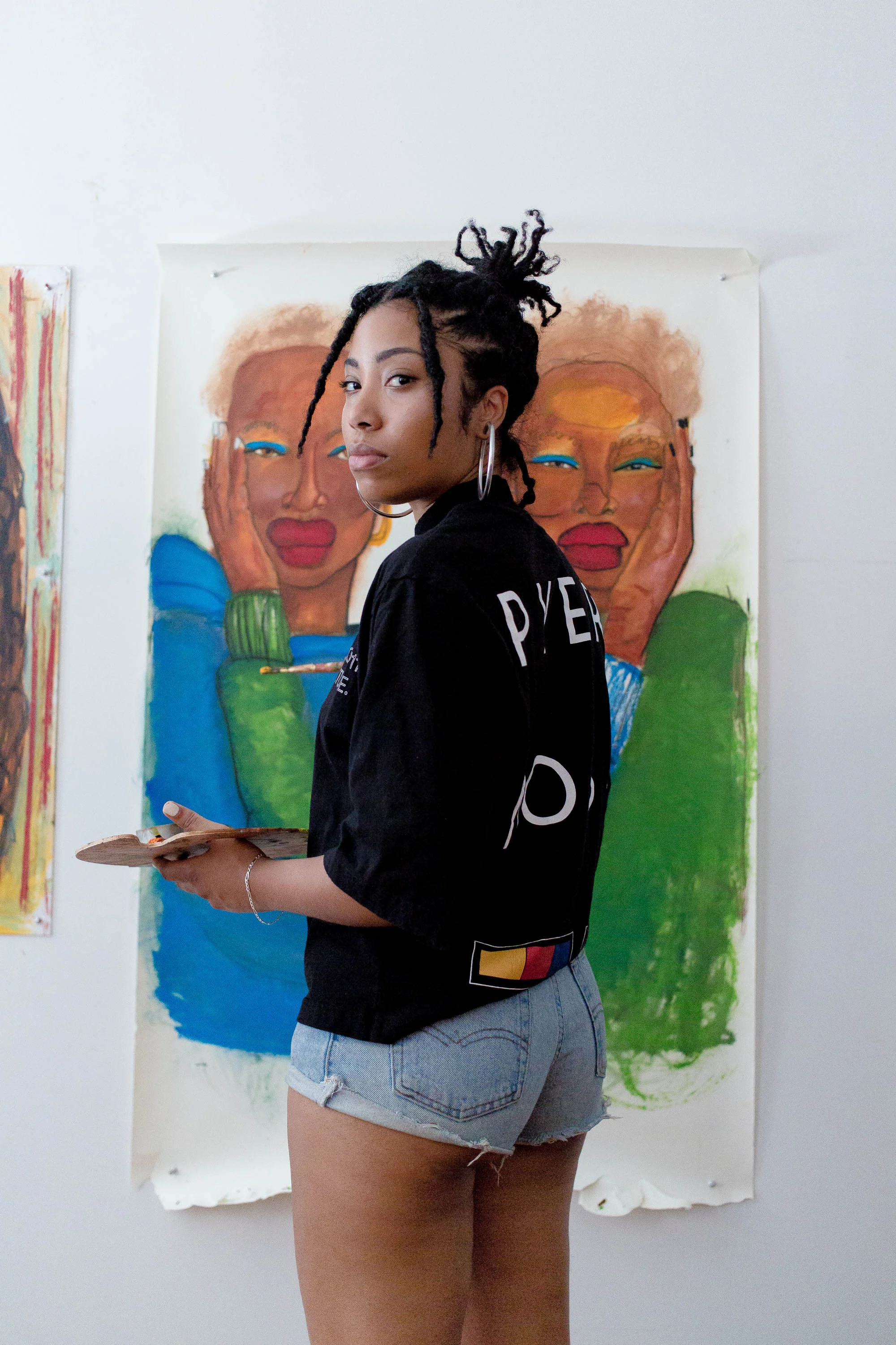 Quiana adding color to the canvas of her most favored painting at the moment.