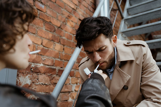 The Social Dynamics of Smoking in Public Spaces