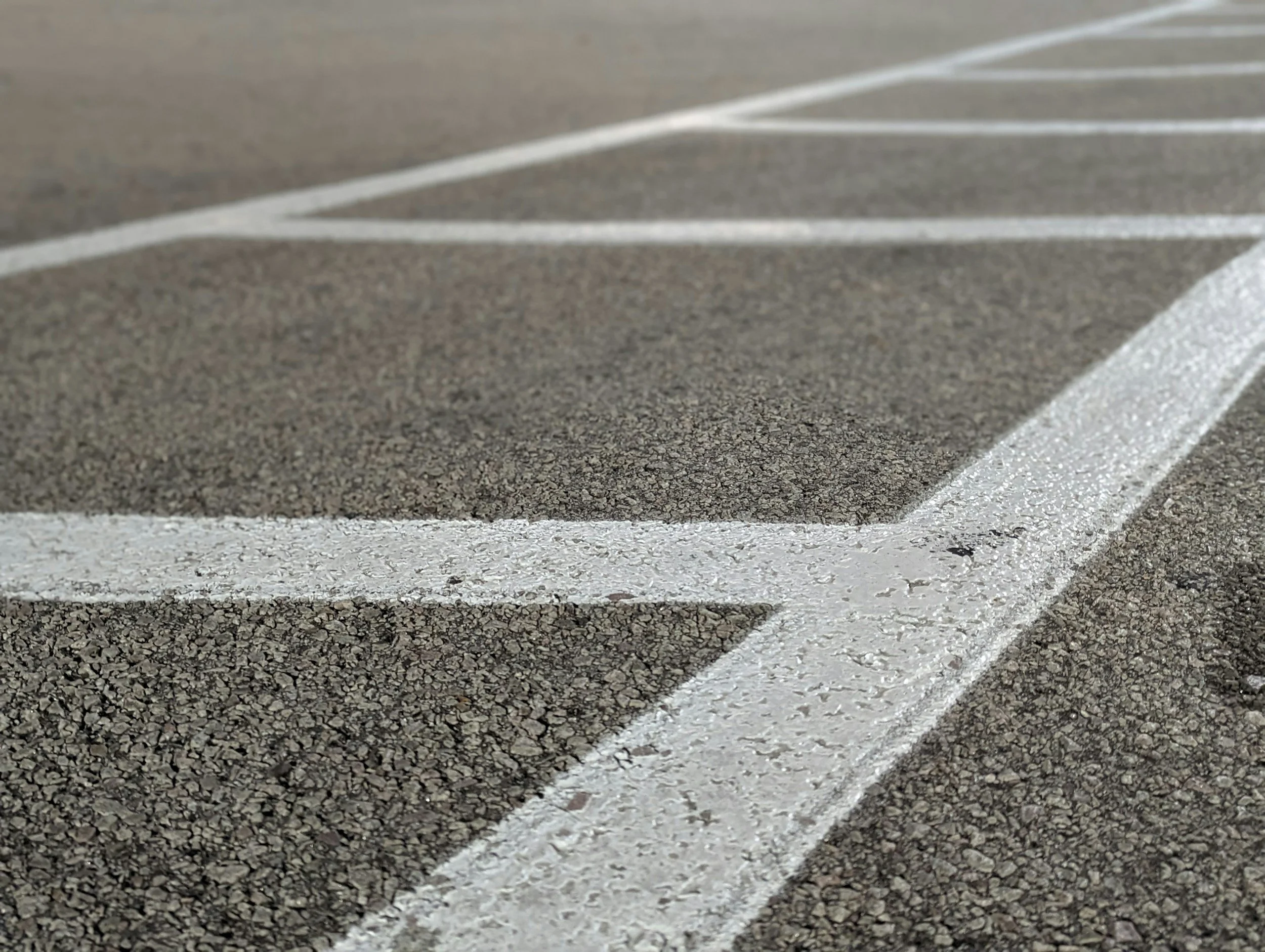 Why Clear Surface Striping is Essential for Organized Parking Environments
