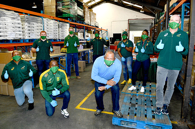 Springboks assist with packing food parcels in Cape Town 
