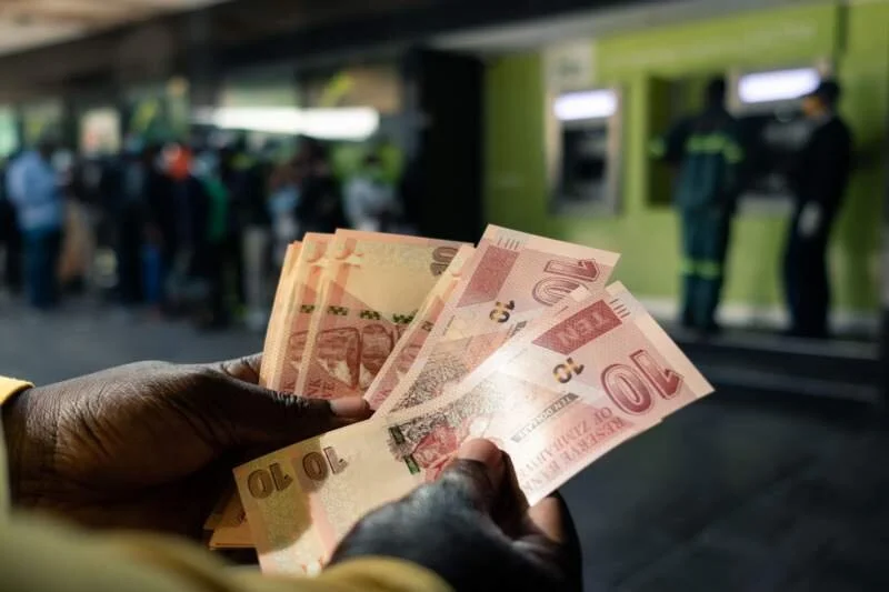 Zimbabwean dollar devalues at first auction 