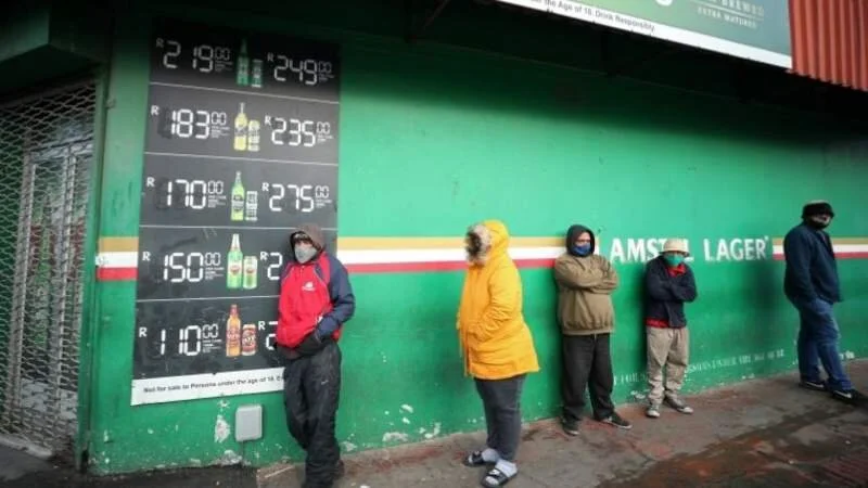 Queues at liquor stores as S Africa eases restrictions