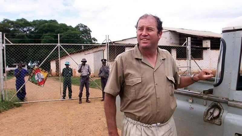 Zimbabwe says white farmers can apply for seized land 