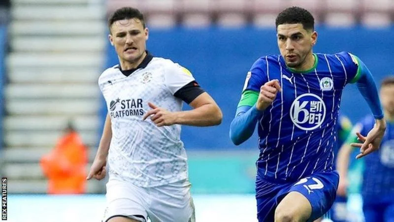 Wigan Athletic: Leon Balogun joins from Brighton, Joe Garner signs new deal