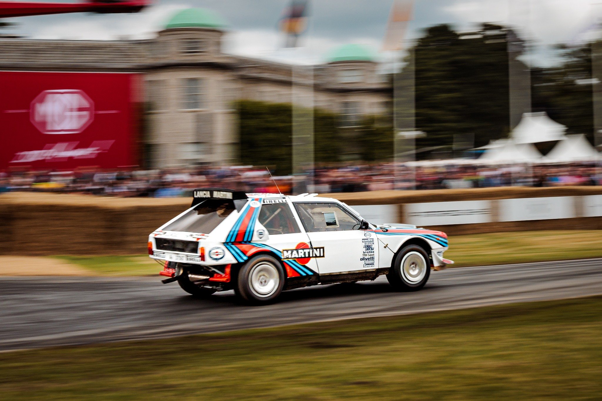 Up close with the Lancia Delta S4 Group B rally car at Goodwood Festival of Speed. Driven up the hill for the first time by James Rimmer.  The car was driven by Henri Toivonen and recorded 22 Stage wins on its first outing, and the first Martini Raci