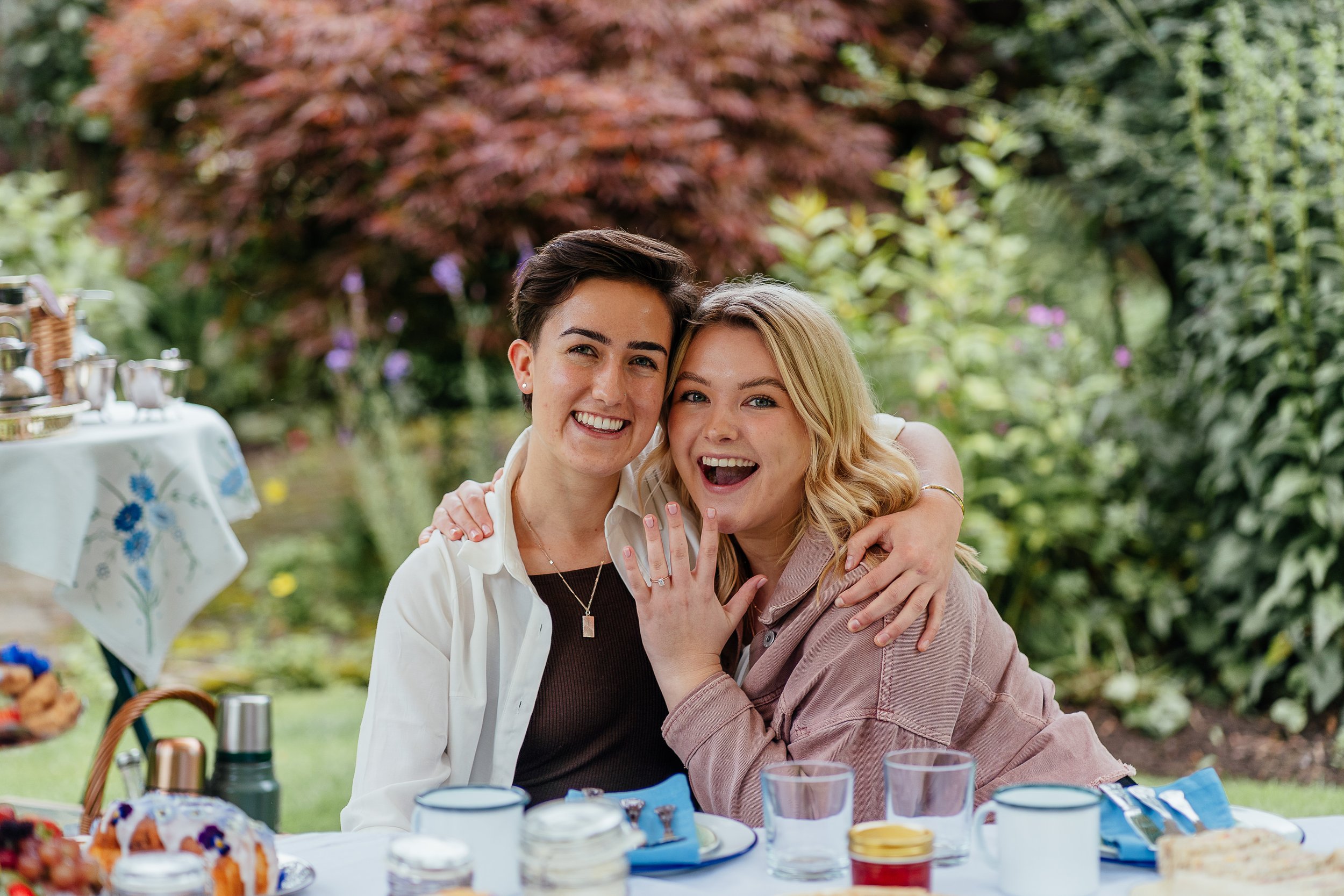 a romantic proposal with a Scottish outdoor picnic set up beneath a canopy