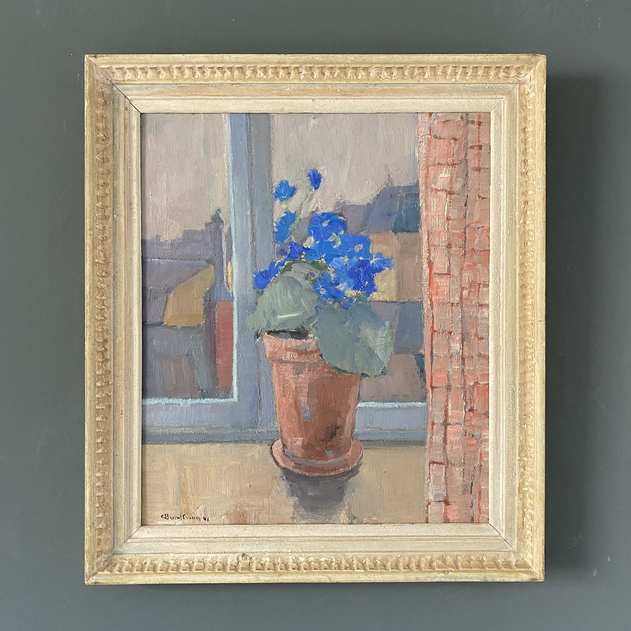 Blue flowers in window