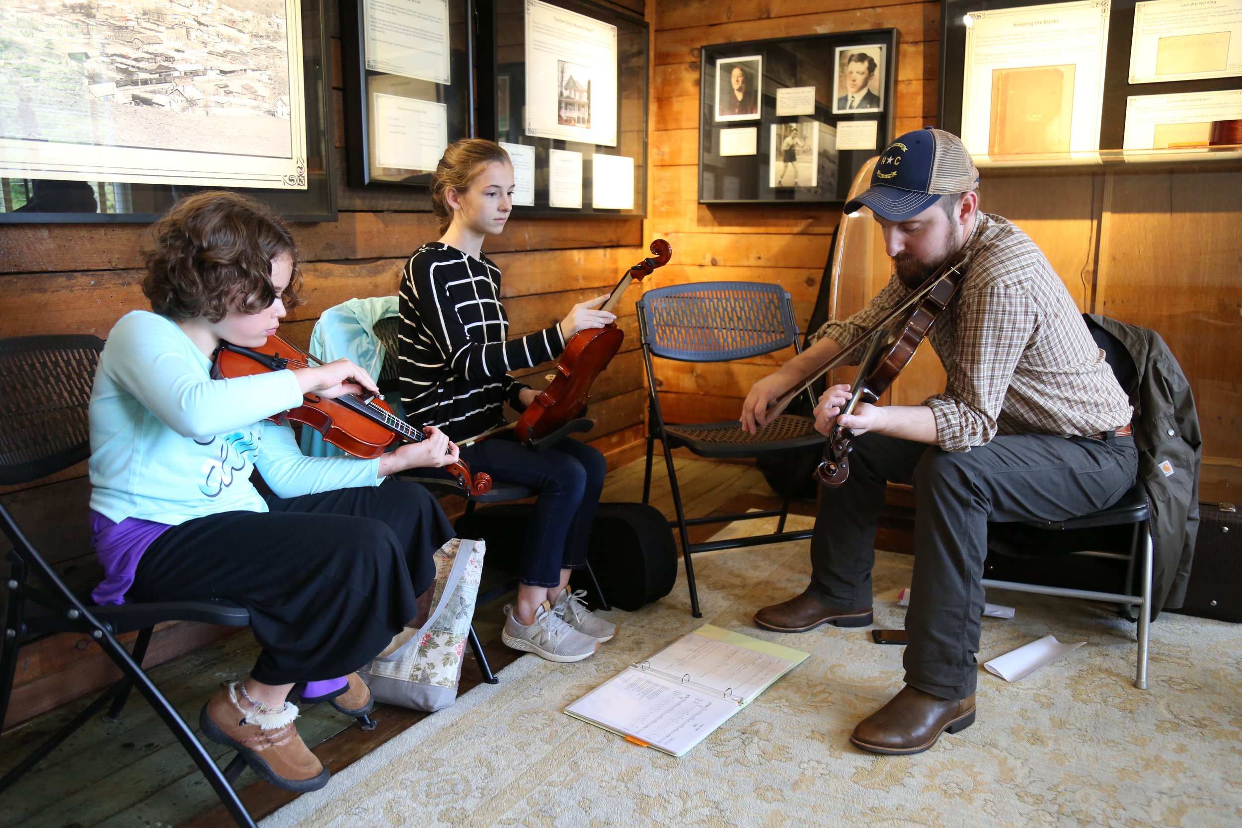 Students learning fiddle at the Boone, NC TAPS/JAM Program 