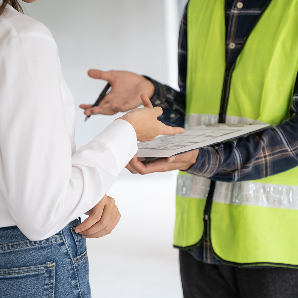 Homeowner speaking with a security professional.
