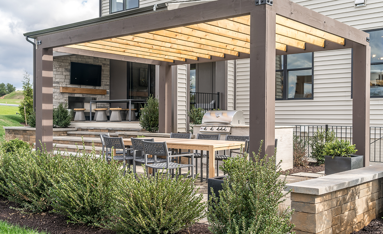 Outdoor living area with a mounted TV and entertainment system at a Greenville, SC home