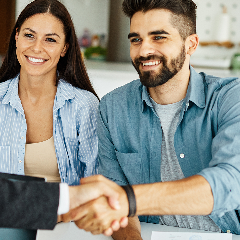 Couple meeting with a home security professional during a consultation in Greenville, SC