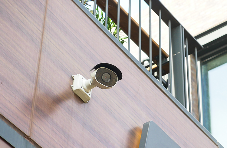 Outdoor security camera installed on a home.