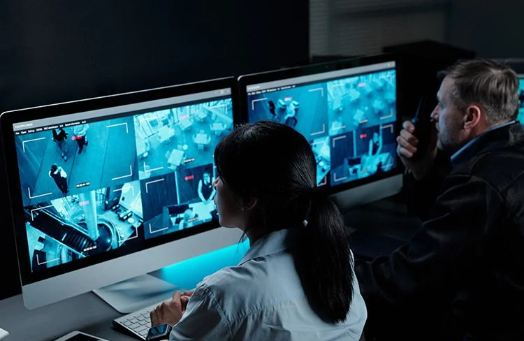 Security professionals monitoring live camera feeds for 24/7 protection of Spartanburg homes.