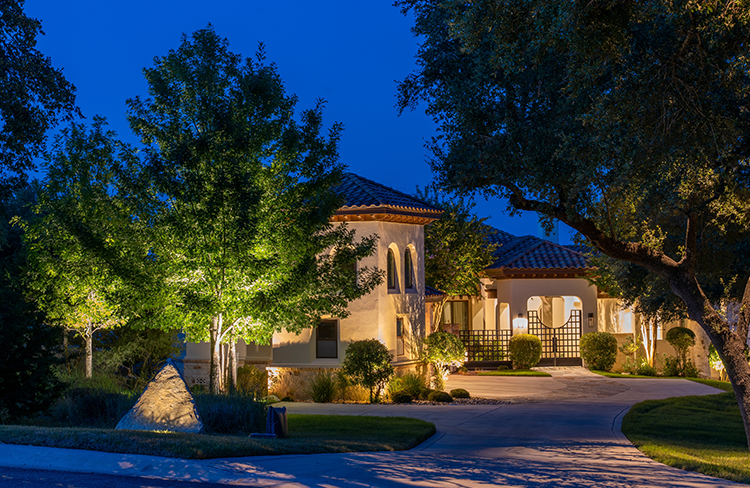 Modern home illuminated at night.
