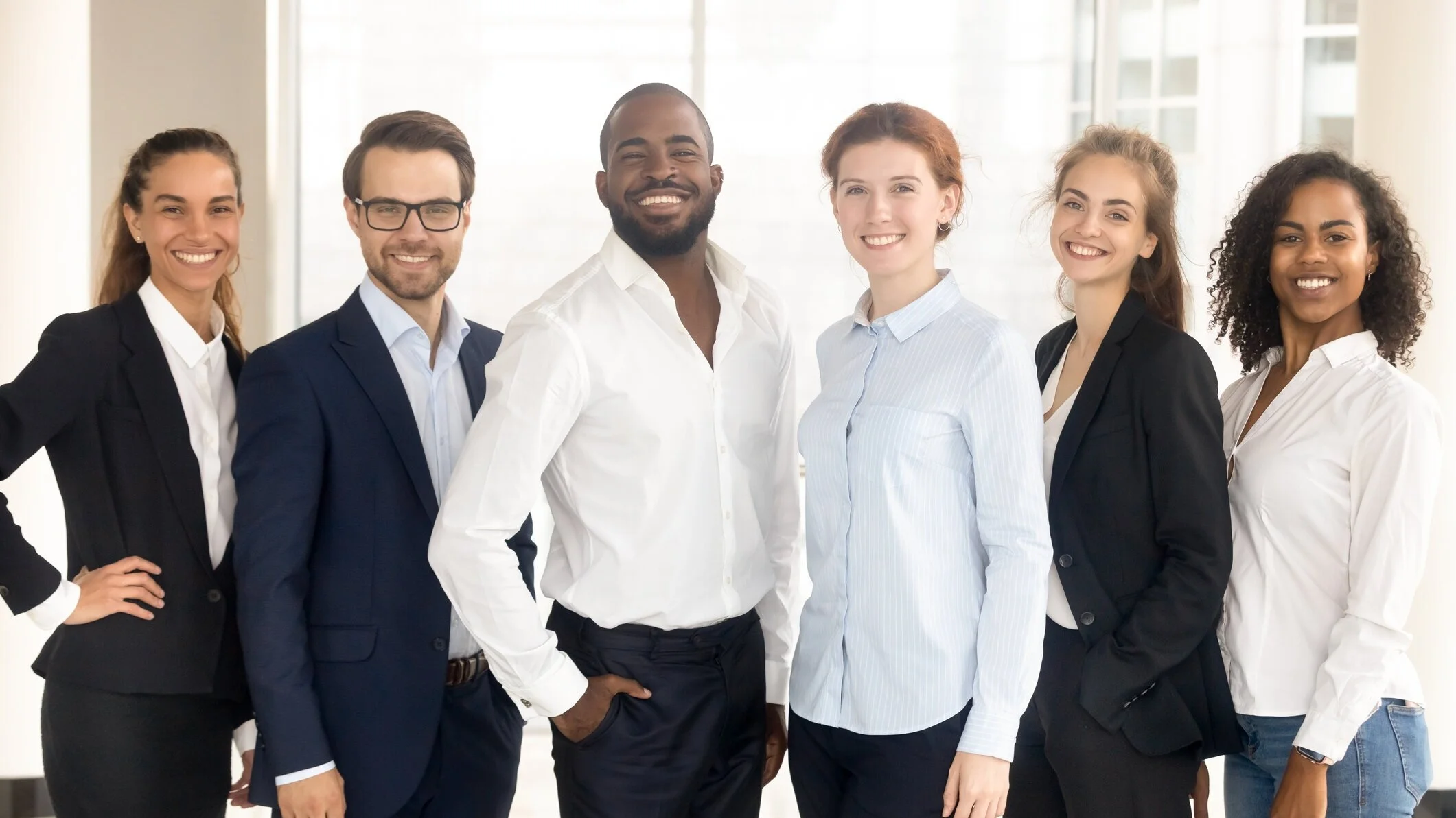 A team of accomplished smiling co-workers