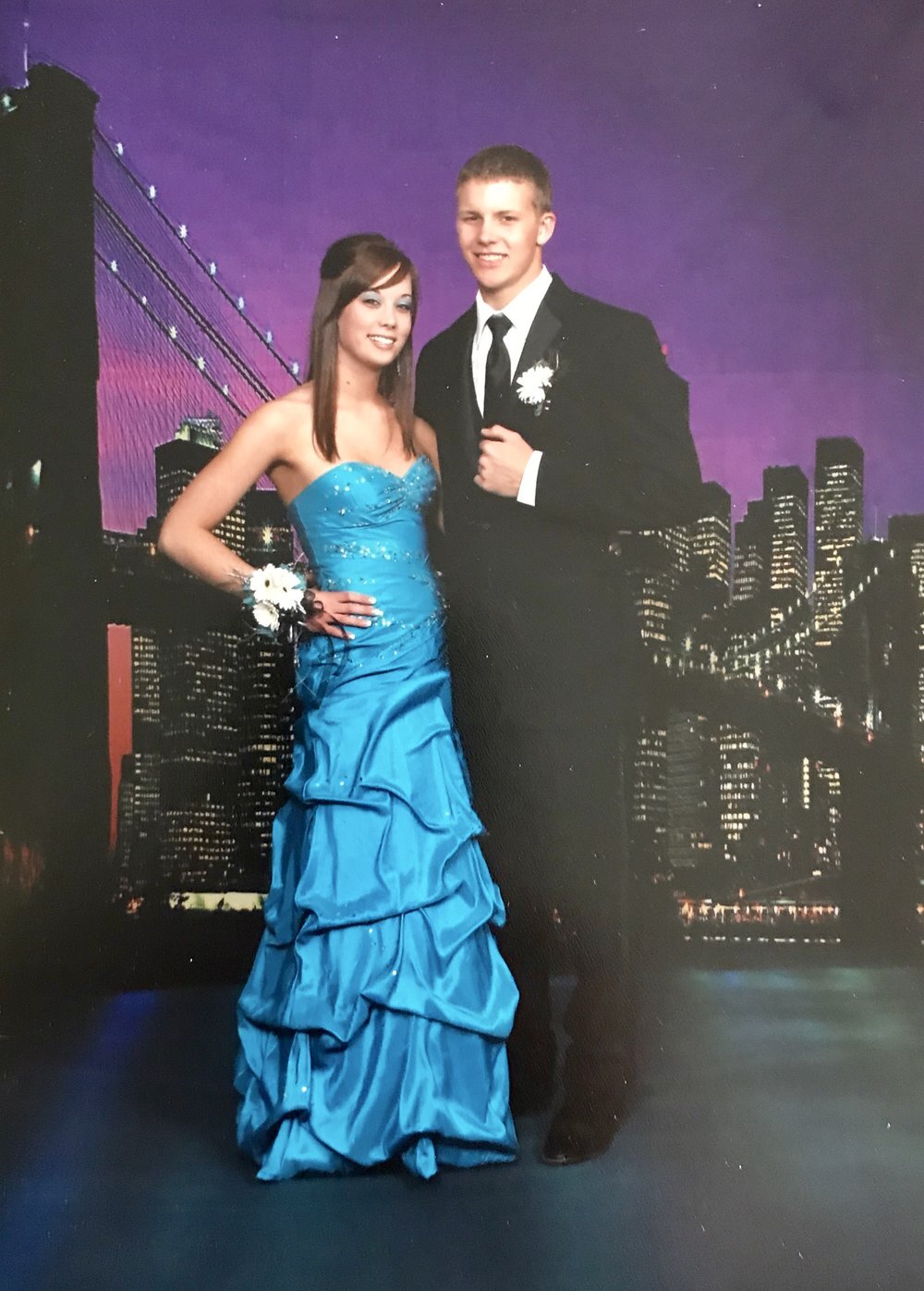 a picture of my wife and i at our high school prom.