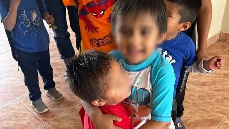two children hugging eachother
