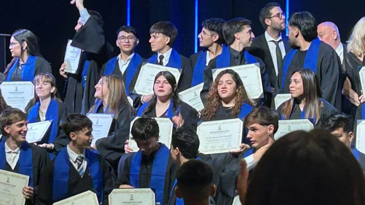 graduates with diplomas