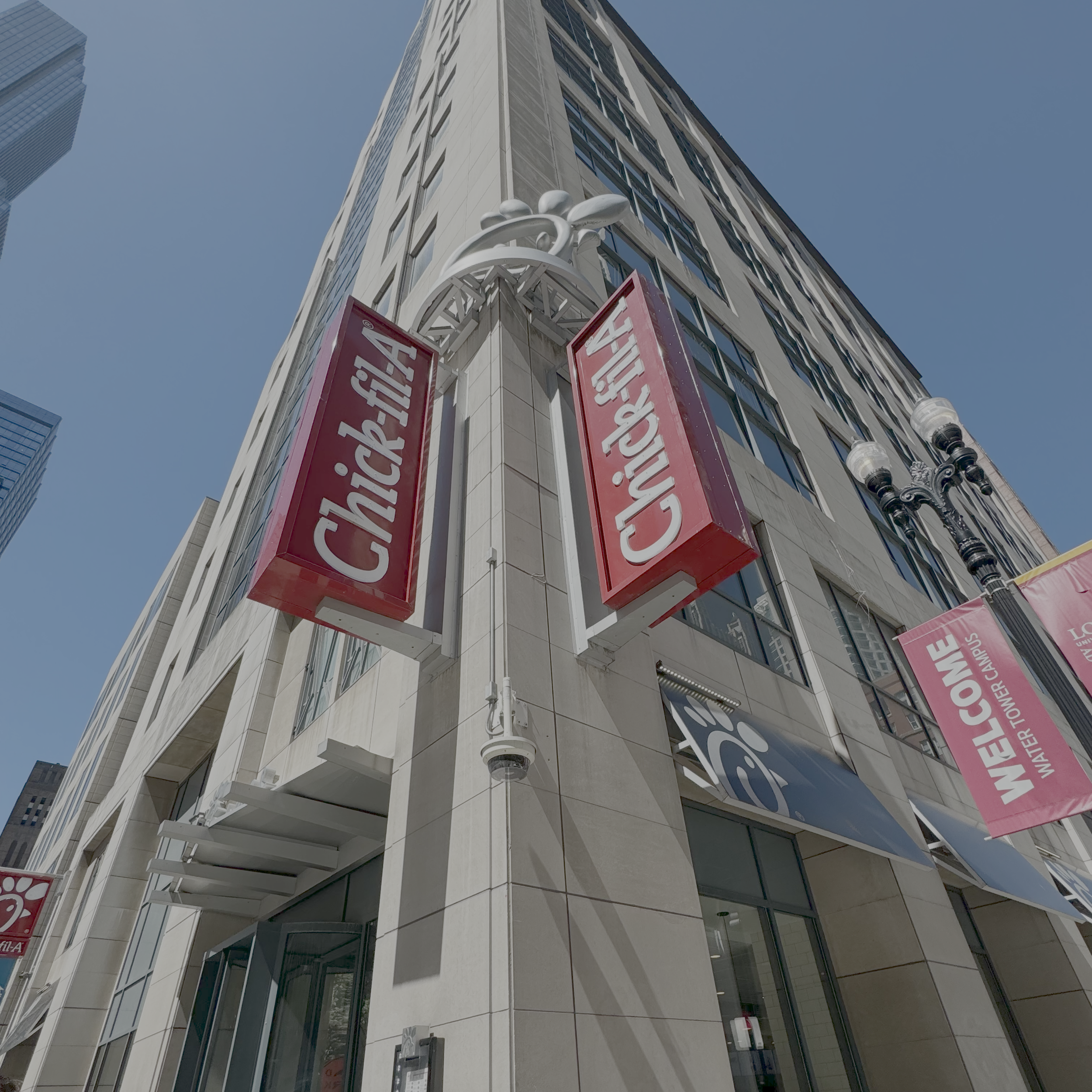 Chick-fil-A Loyola Water Tower building with blue sky