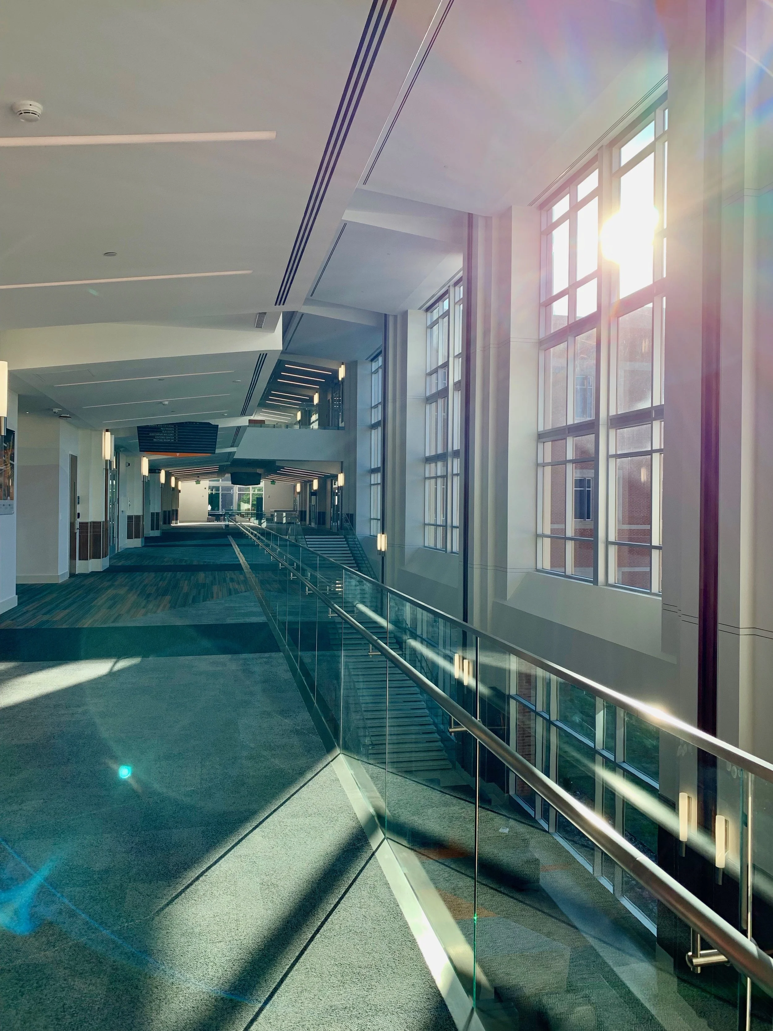  I really like this photo. I’m a big fan of architecture and angles, so this quickly-captured photo from the new Student Union building at UT is a recent favorite. The lens flare colors are great,  and the sharp angles of the reflections look sick.  