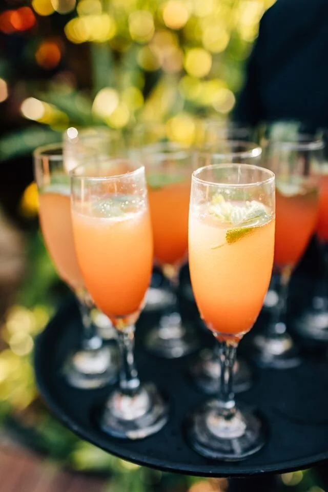 tray with fruity mimosa drinks