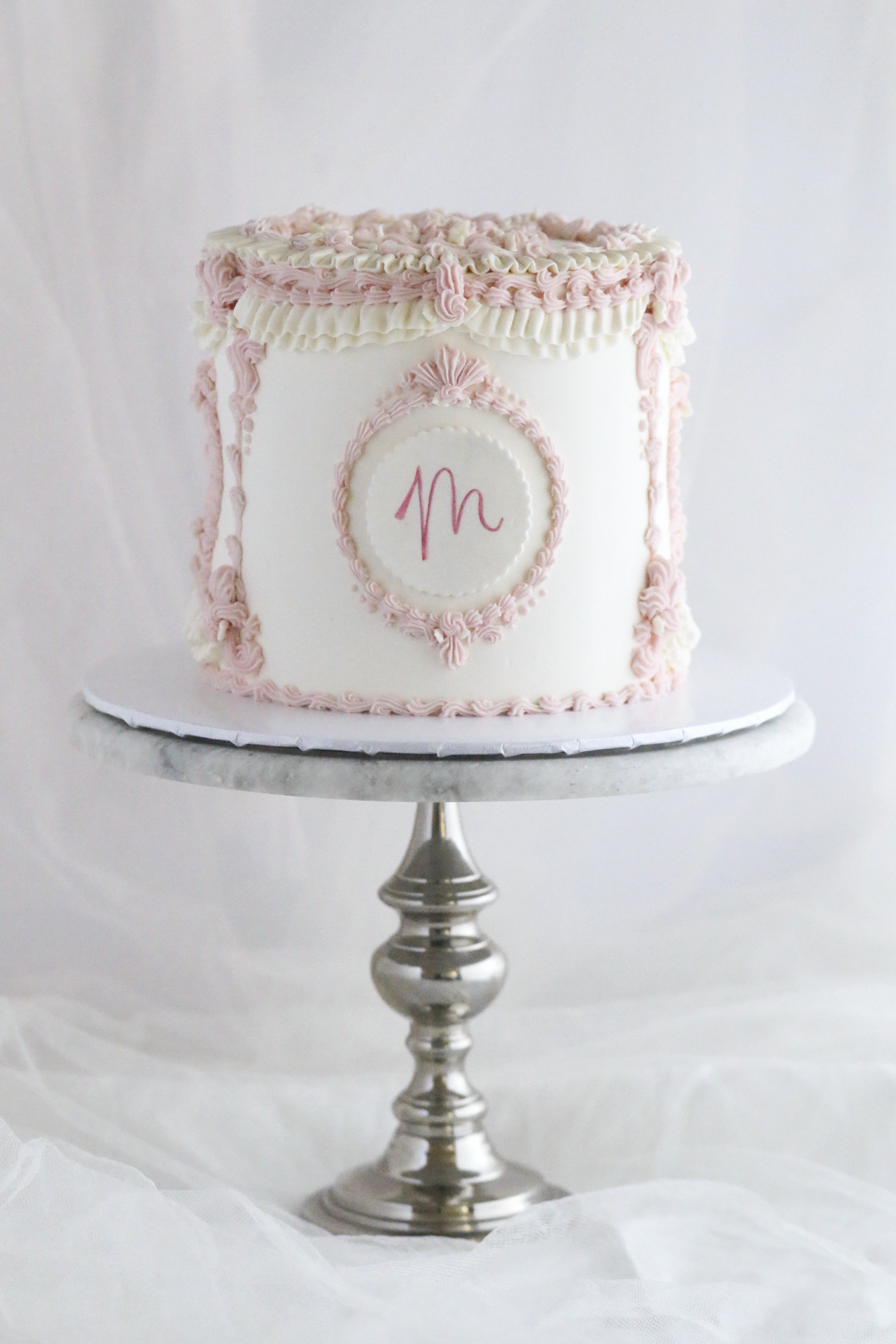 Vintage pink and ivory buttercream cake with piped monogram by Rose Vanilla
