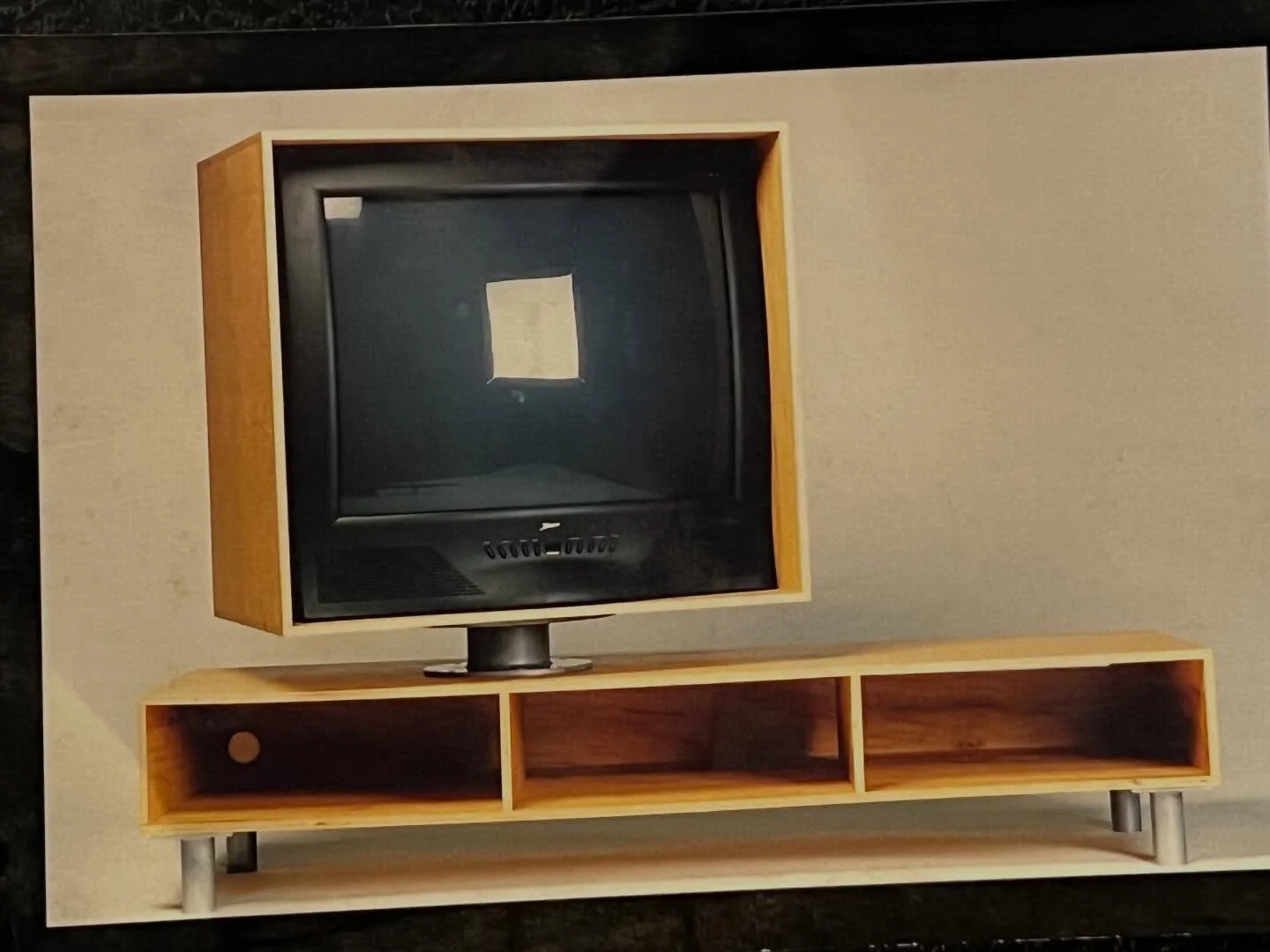 Blast from the past.  Remember the old school tube based TV sets?  Back in the late 90s, I designed this knock down unit to reference the 1950s Philco Predicta TV.  This modern version featured a box to mostly hide the influence tv set that was set o